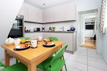 The kitchen has space for all the family to gather for a tasty meal.