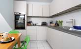 Sleek clean lines of the kitchen/dining-room. - Thumbnail Image