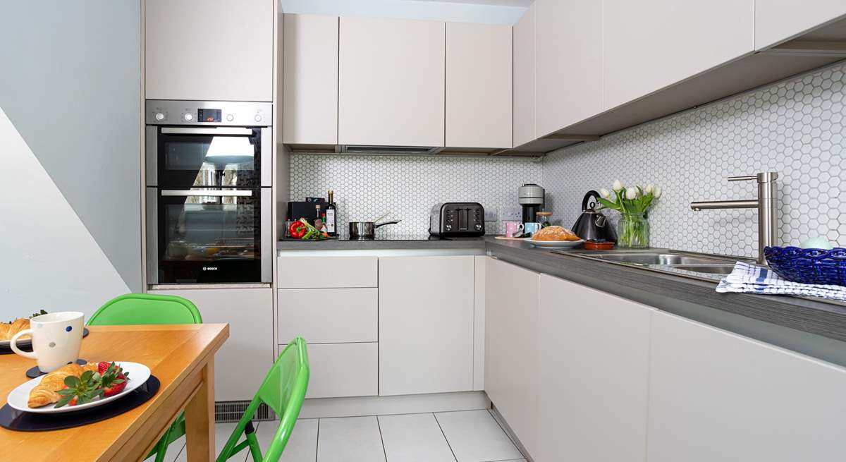 Sleek clean lines of the kitchen/dining-room.