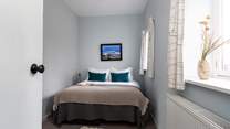 This king size bed can be separated into a twin for children.