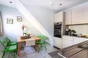 The kitchen has space for everyone to gather for a tasty meal.
