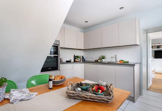 Sleek clean lines of the kitchen/dining room.