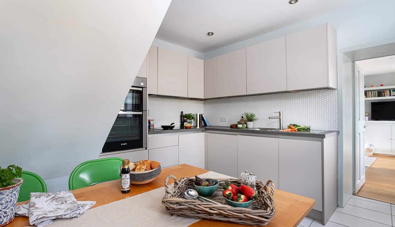 Sleek clean lines of the kitchen/dining room.