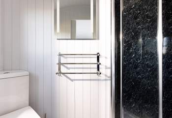 The en suite shower-room is sleek and simplistic. 