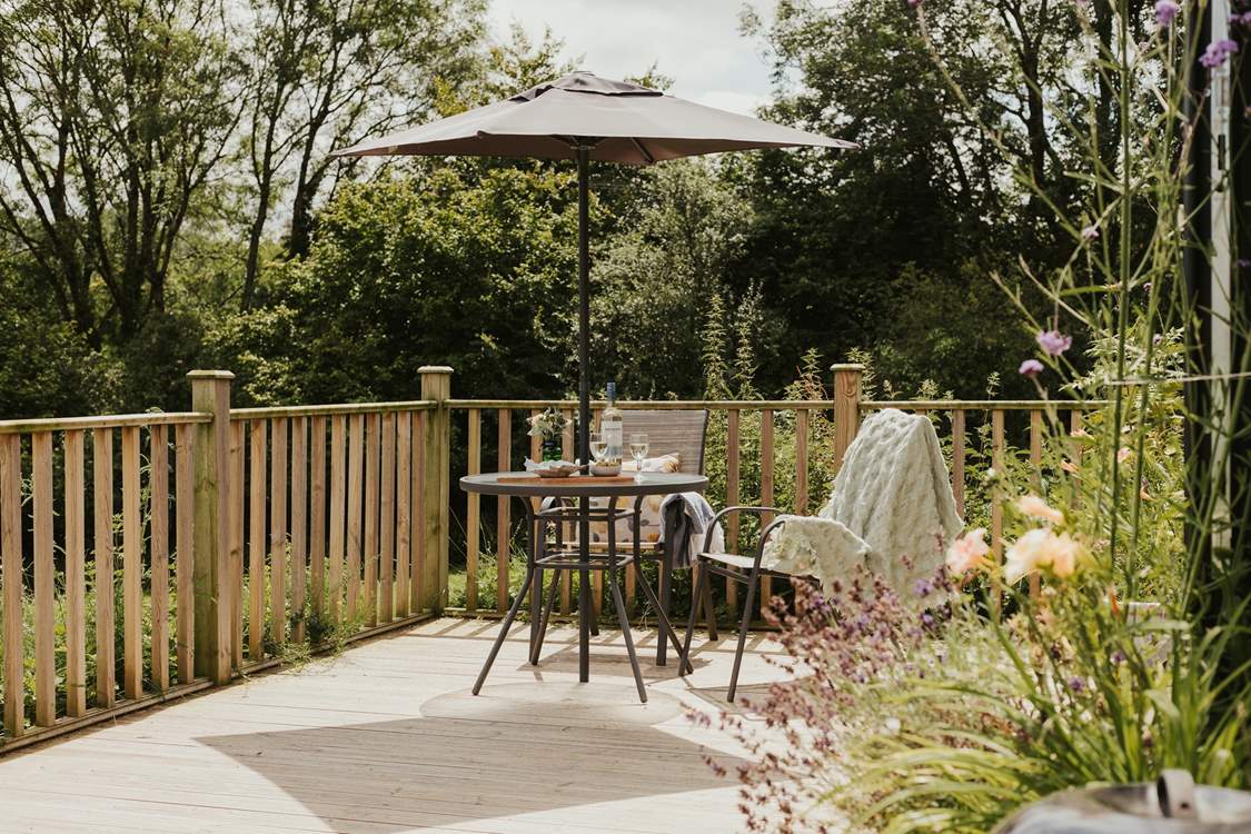 Dine on the deck as the sun slips beyond the horizon.