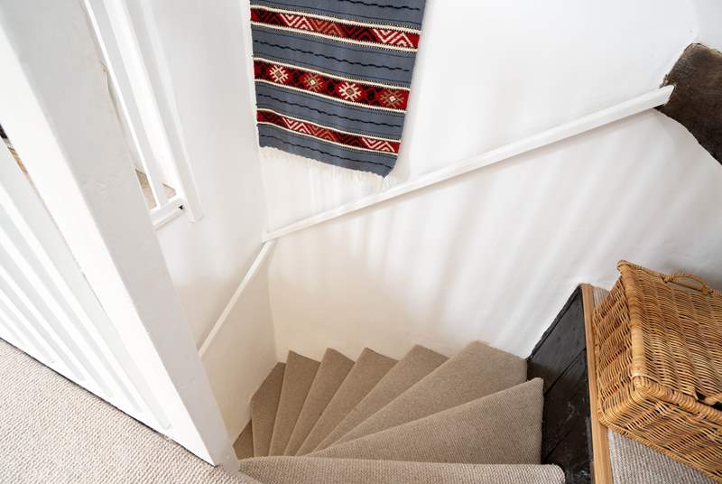 Winding stairs lead to the bedroom...be careful they are a bit steep but well worth it when you get to the top!