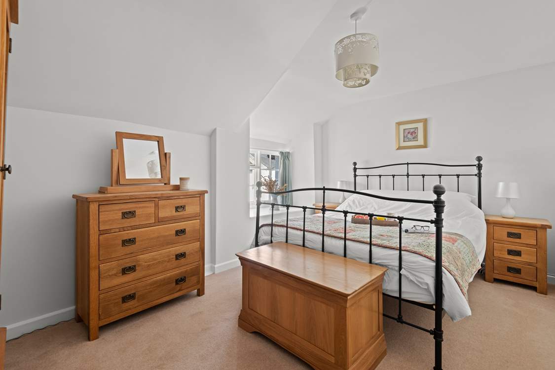 Bedroom 1 is a charming room with a king-size bed.