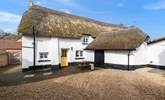 The beautiful back of the house, with parking and a picnic table. - Thumbnail Image