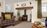 Sink into the armchair next to the wood-burner, and relax... - Thumbnail Image