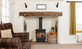 Sink into the armchair next to the wood-burner, and relax... - Thumbnail Image