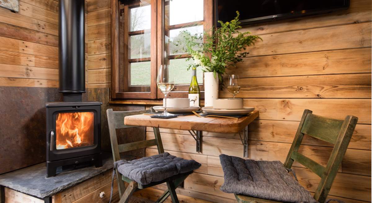 Watch the embers soften as you stay snug by the wood-burner.