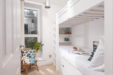 The charming bunk-beds in bedroom 2 are suitable for children only.