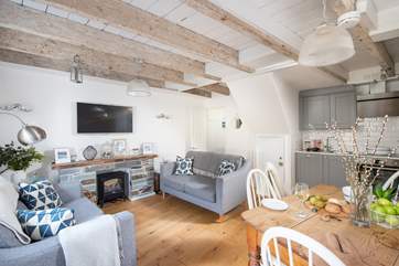The gorgeous open plan living space with sitting, kitchen and dining areas.