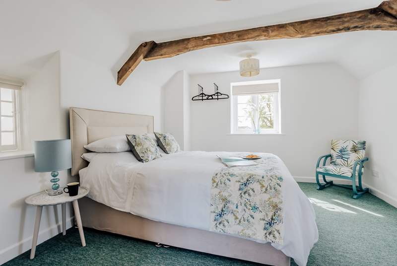 Take a moment to relax in the beautiful bedroom that overlooks the garden.