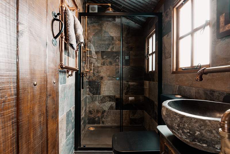 We love the copper details in the gorgeous shower-room.