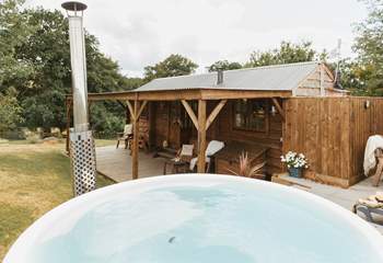 Boasting a secluded wood-fired hot tub and tranquil views of sweeping countryside vistas.