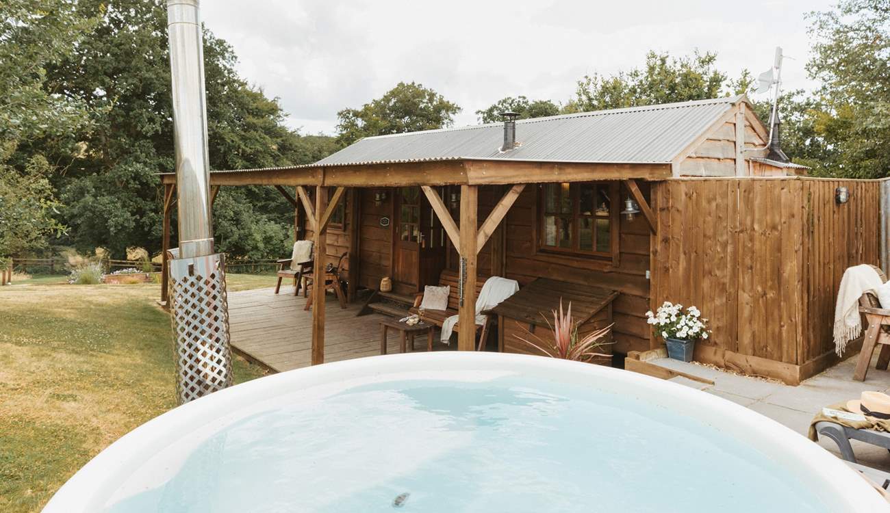 Boasting a secluded wood-fired hot tub and tranquil views of sweeping countryside vistas.