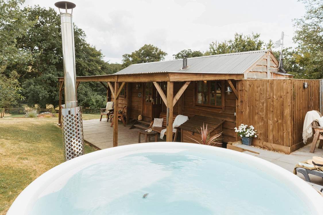 Boasting a secluded wood-fired hot tub and tranquil views of sweeping countryside vistas.