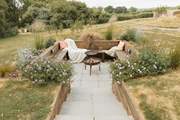 Step down into the cosy fire-pit area and share stories under the stars!
