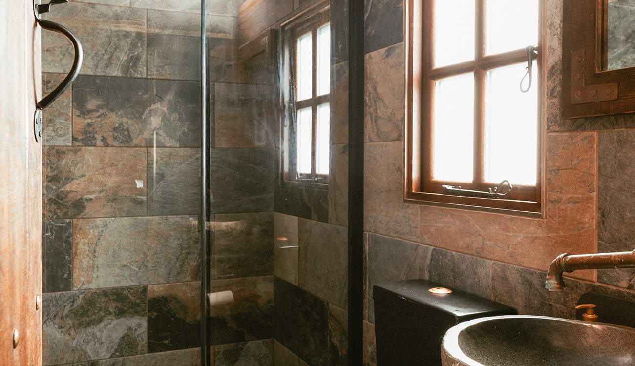 We love the copper details in the gorgeous shower-room.