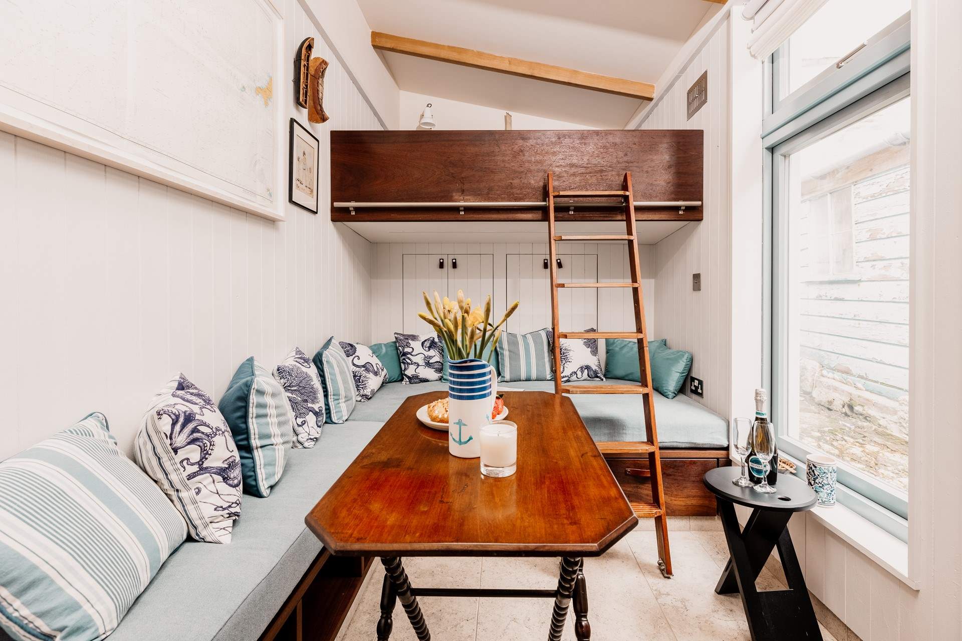 The table folds away and hangs on the wall to save space. 