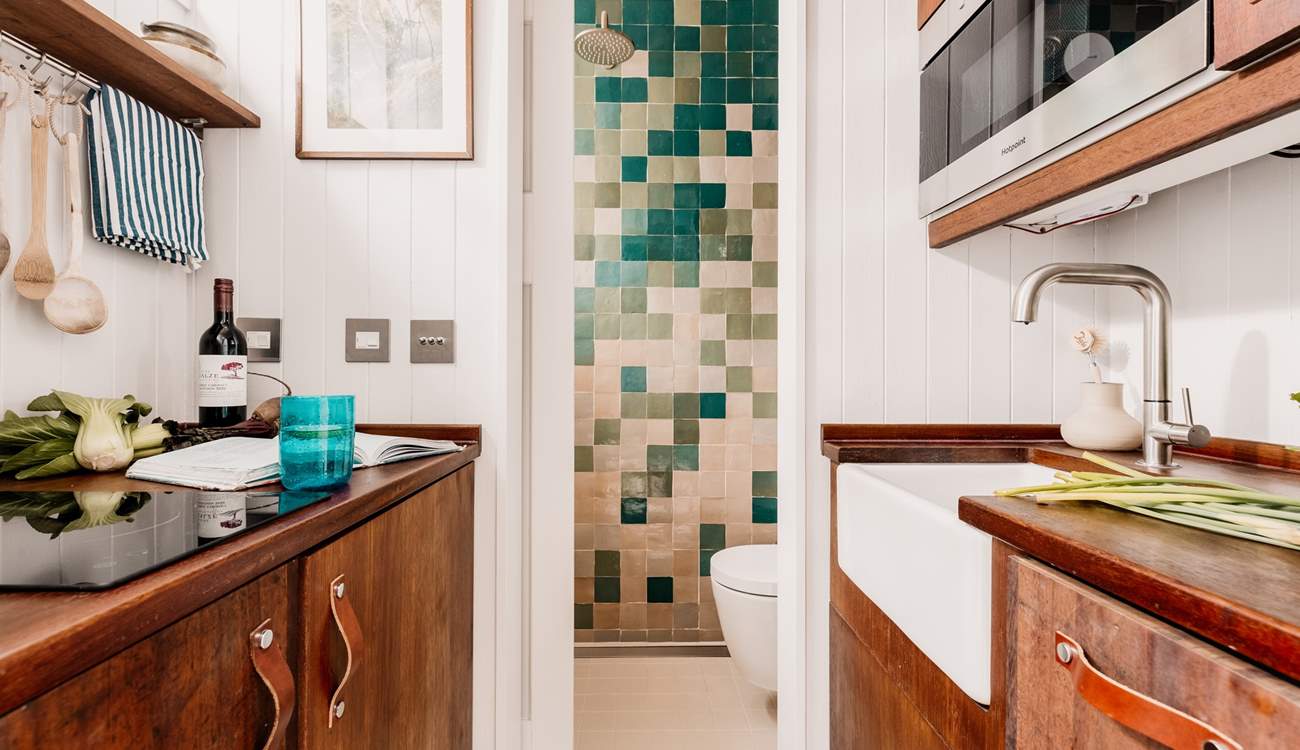 The kitchen leads through to the charming shower-room. 
