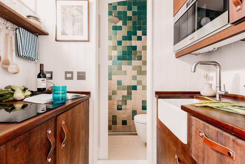 The kitchen leads through to the charming shower-room. 