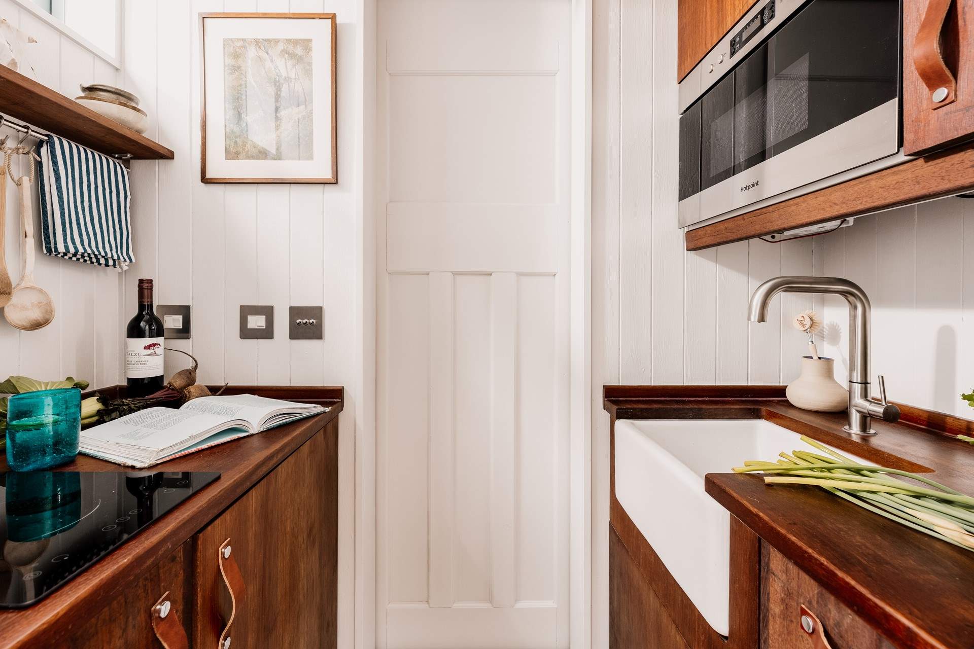 The kitchen may be small but is cleverly designed to hold everything you need for your getaway. 