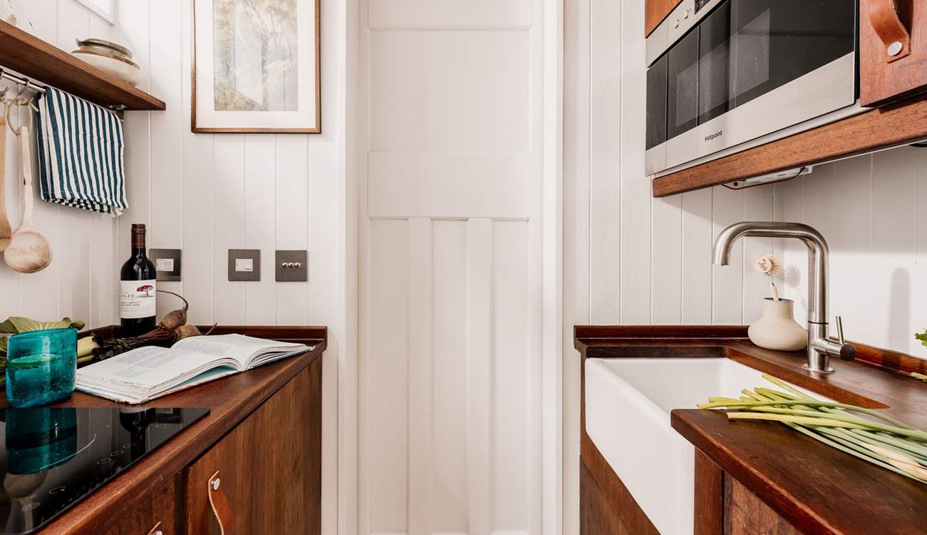 The kitchen may be small but is cleverly designed to hold everything you need for your getaway. 