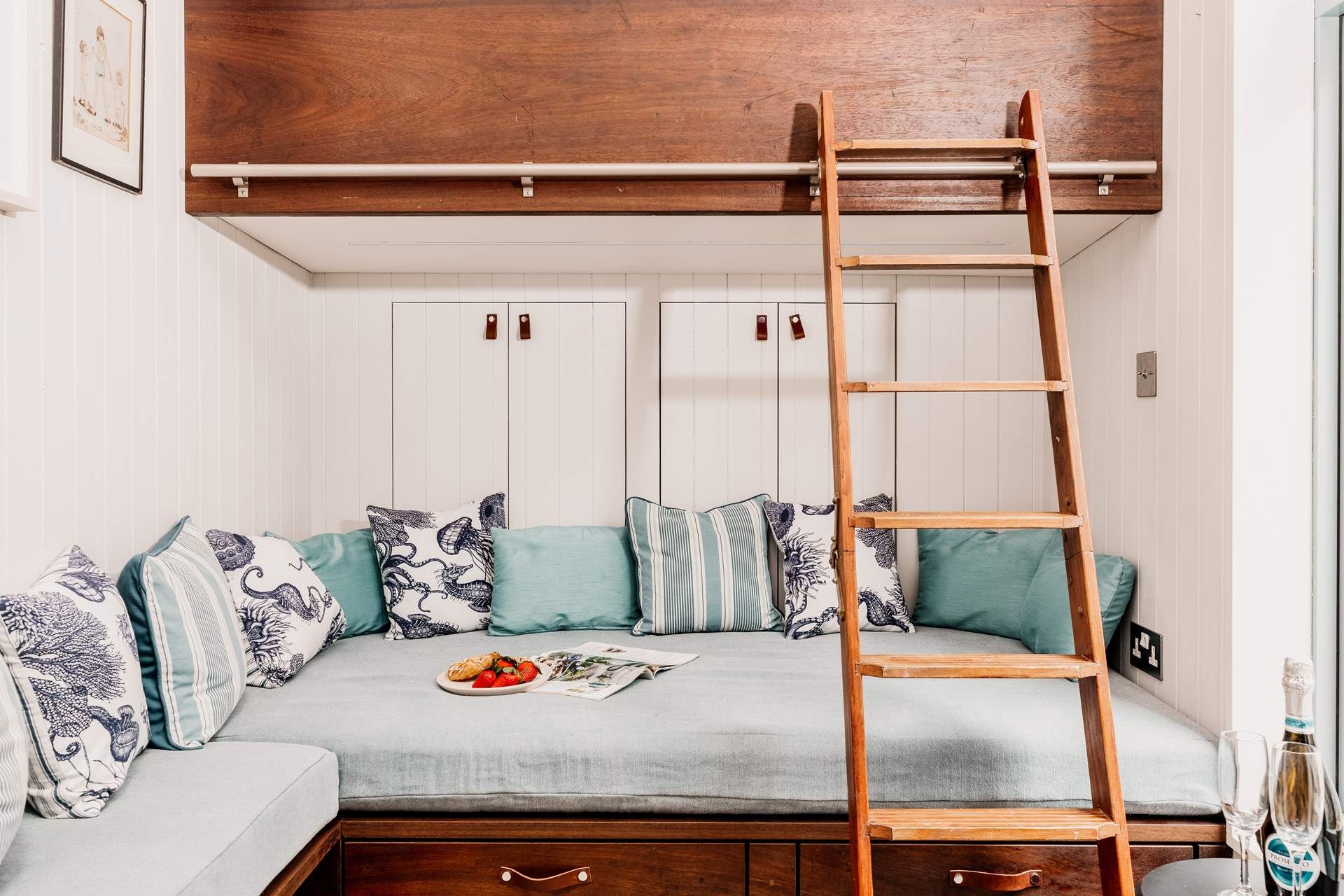 Make use of the storage spaces behind and below the seating area. 