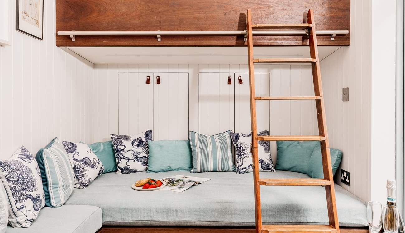 Make use of the storage spaces behind and below the seating area. 