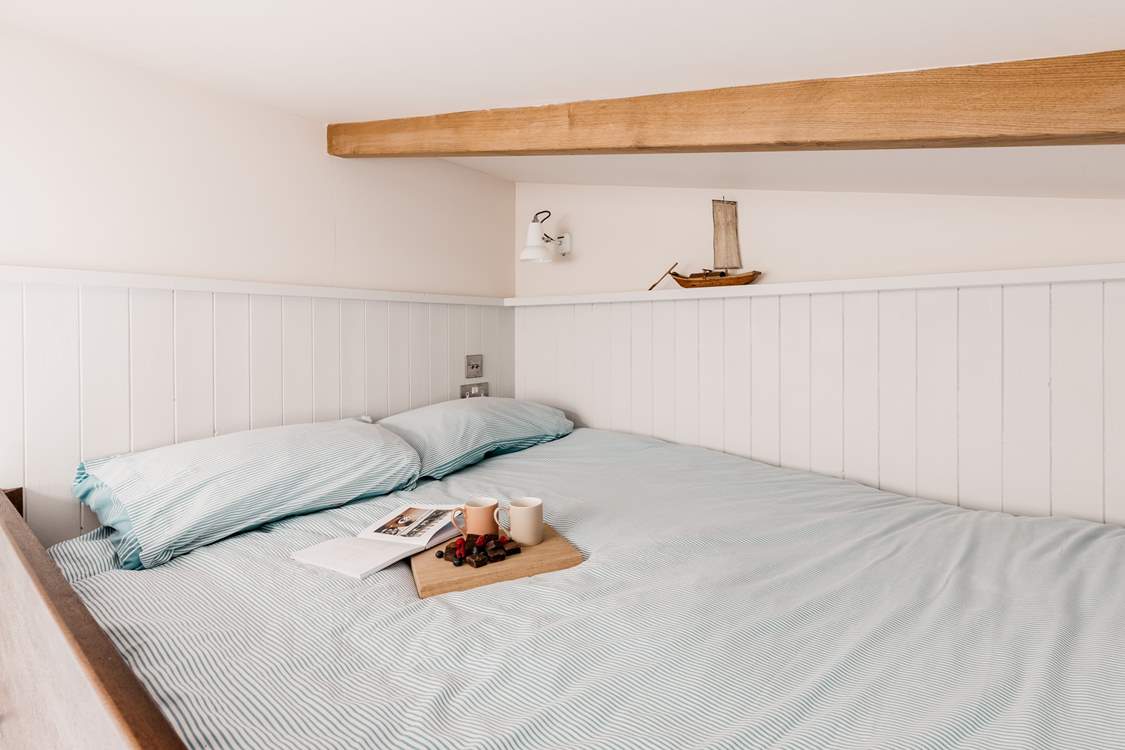 Climb the ladder to find your lovely king-sized bed.