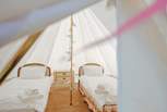 There are two single beds in the bell tent, a lovely little den!