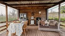 The quirky outdoor kitchen is a lovely place to cook, dine and  relax.
