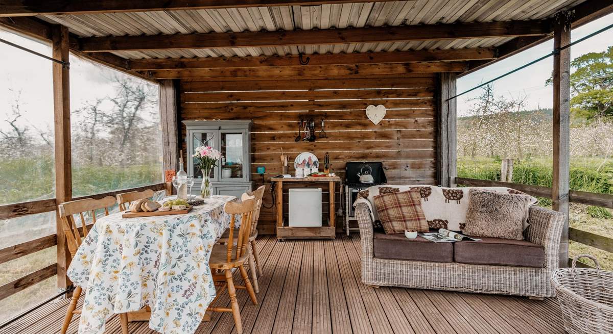 The quirky outdoor kitchen is a lovely place to cook, dine and  relax.