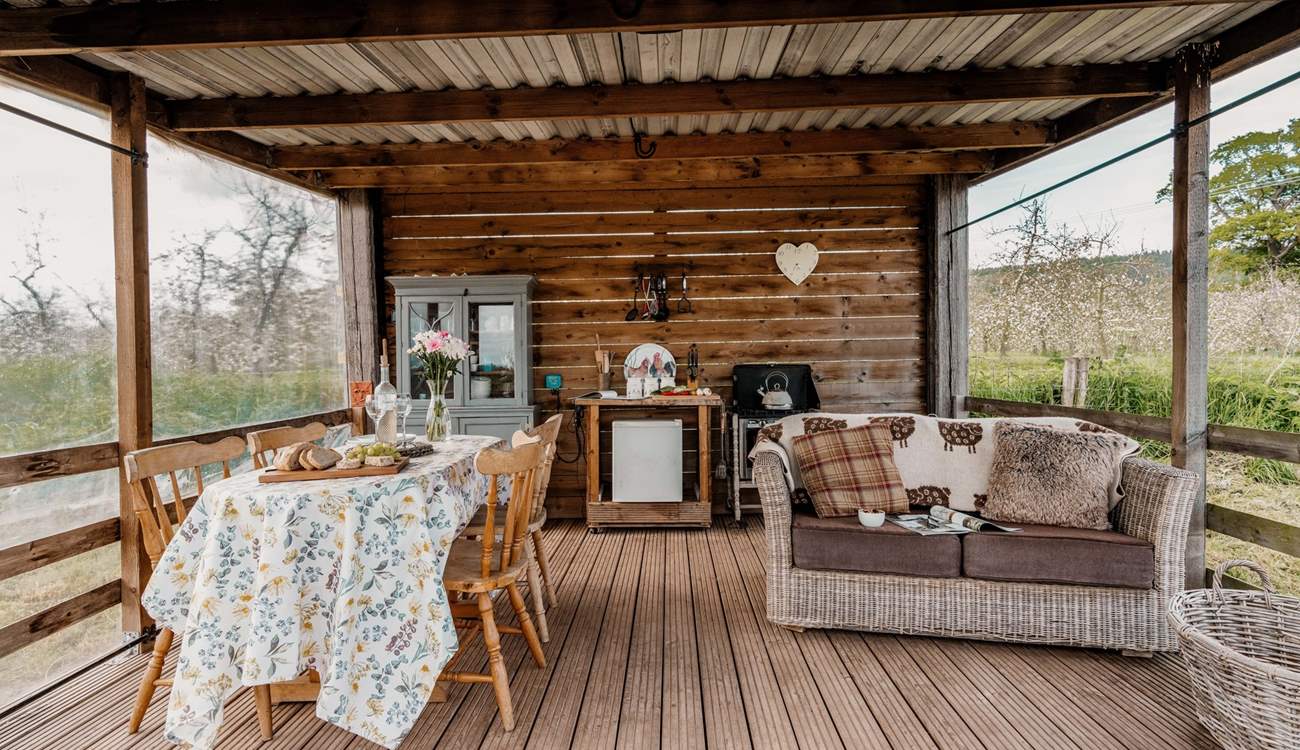 The quirky outdoor kitchen is a lovely place to cook, dine and  relax.