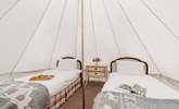 You'll find two single beds in the bell tent. - Thumbnail Image