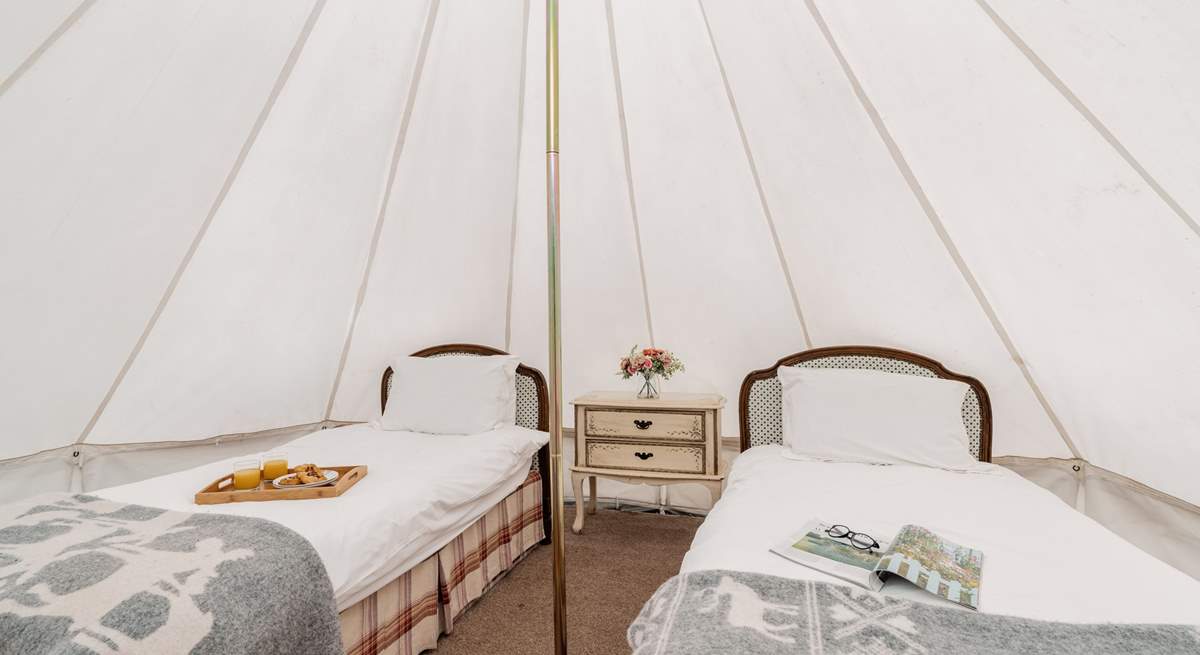 You'll find two single beds in the bell tent.