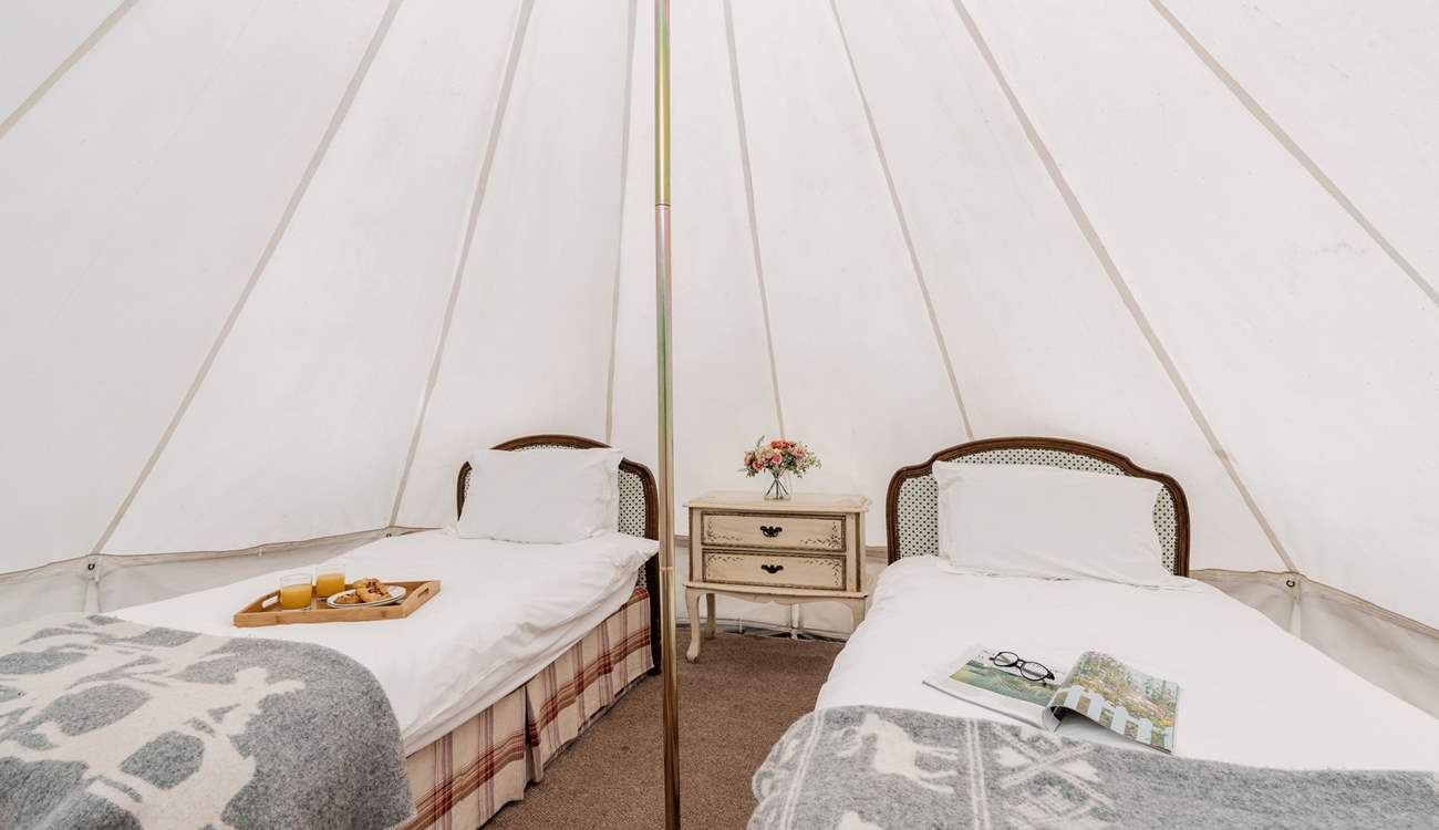 You'll find two single beds in the bell tent.