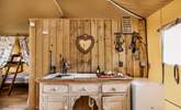 The kitchen area pays respect to a traditional style of glamping. - Thumbnail Image