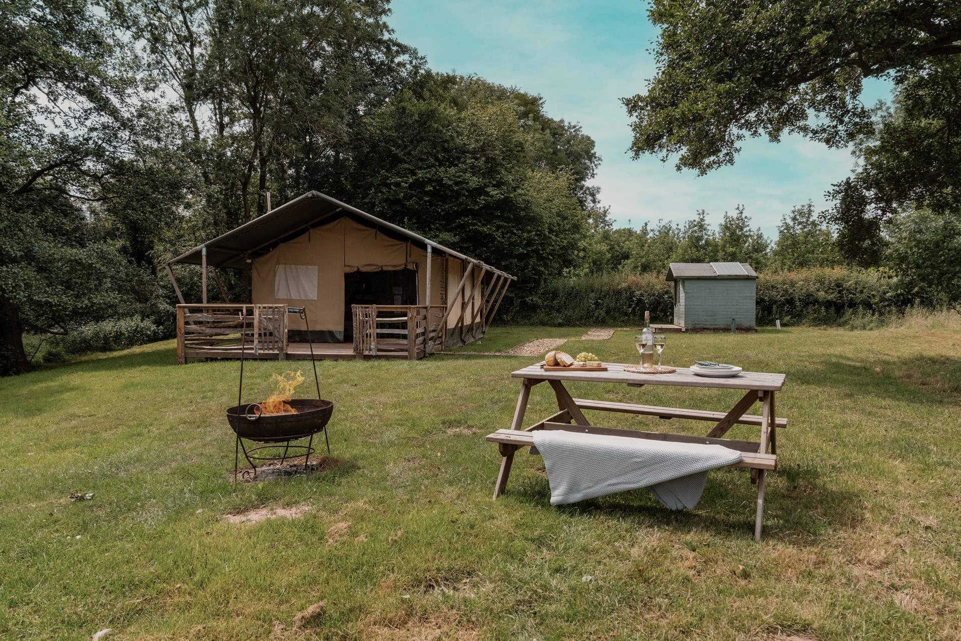 The separate shower-room sits to the right of the safari tent.