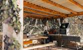 The outdoor kitchen offers the ultimate al fresco dining experience. - Thumbnail Image