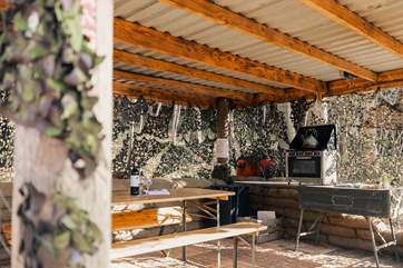 The outdoor kitchen offers the ultimate al fresco dining experience.