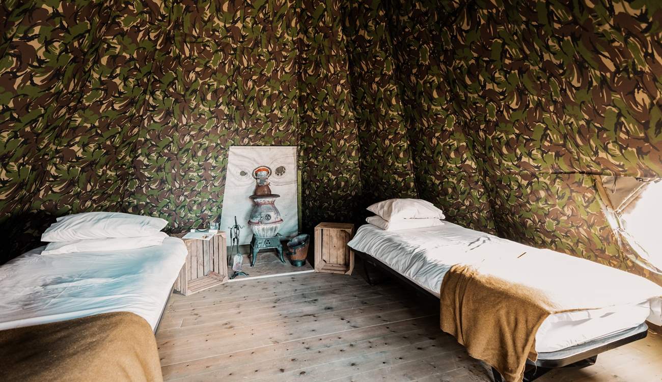 Inside, you will find two single beds and a characterful wood-burner. 