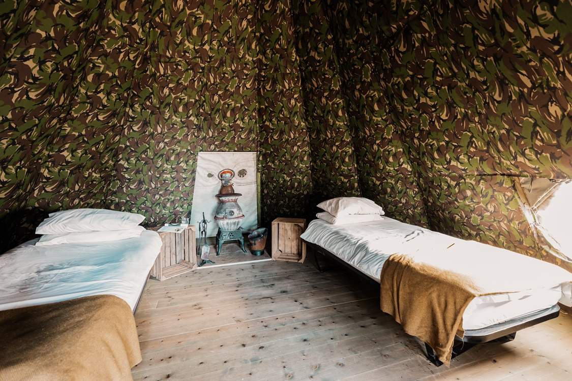 Inside, you will find two single beds and a characterful wood-burner.