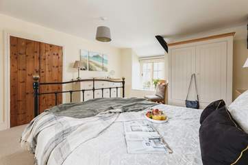 Oh so pretty, bedroom one has a comfy king-size bed.