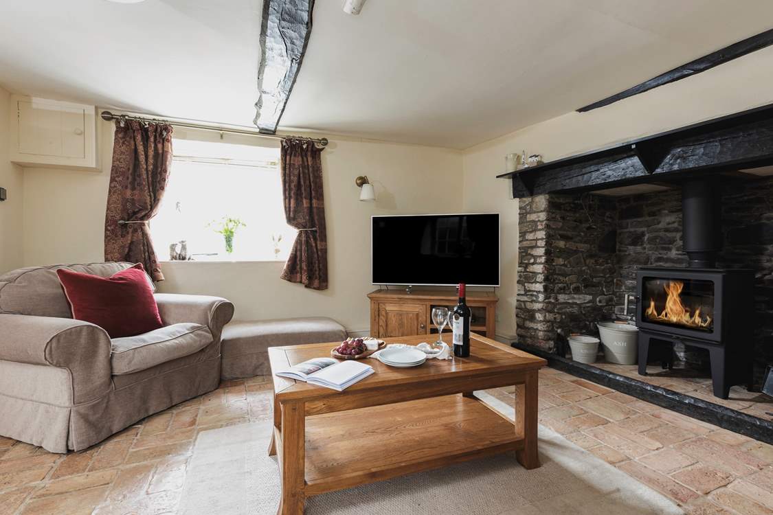 Cobble Cottage has charming traditional features such as this fabulous fireplace.