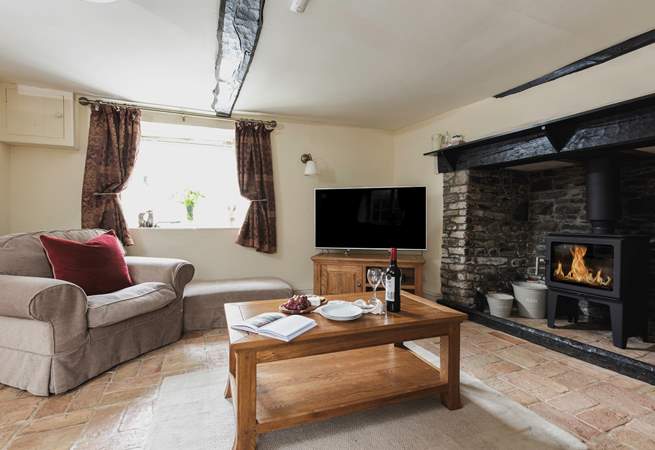 Cobble Cottage has charming traditional features such as this fabulous fireplace. 