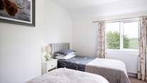 Look out onto the beautiful garden and surrounding farmland.