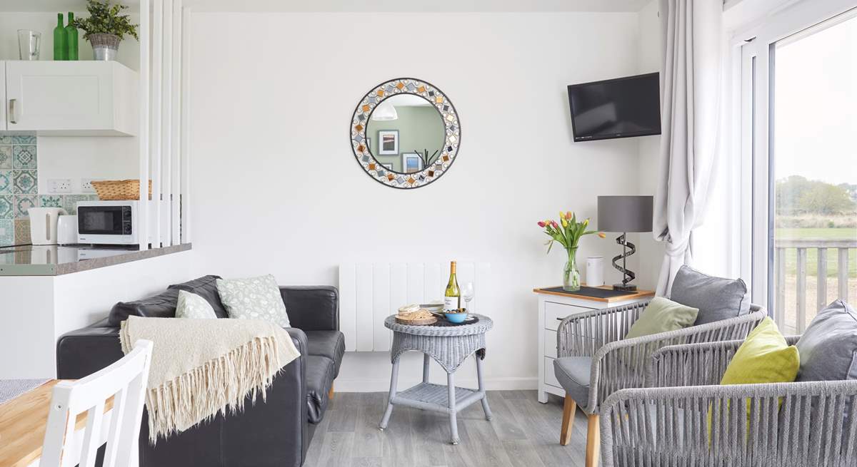 Your lovely lounge space looks towards your outside terraces and nature reserve beyond. 
